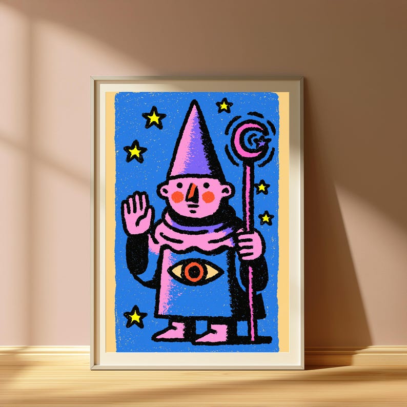 May include: A framed art print featuring a pink-skinned wizard in a purple pointed hat and robe, holding a staff with a crescent moon topper. The wizard has an eye symbol on the robe, a raised hand, and is surrounded by yellow stars on a blue background.