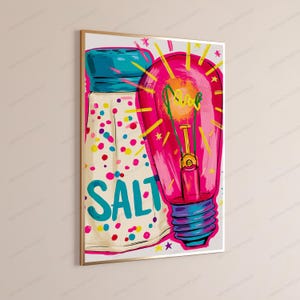 May include: A vibrant wall art print featuring a stylized illustration of a salt shaker with colorful confetti-like dots and the word SALT in large blue letters, positioned next to a glowing pink light bulb with yellow rays and stars.