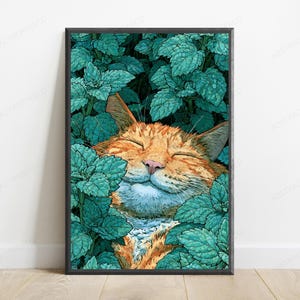 May include: A framed vertical art print featuring an orange tabby cat with closed eyes and a content expression, nestled within a dense patch of vibrant teal green mint leaves. The cat's fur is orange with darker stripes, and the leaves are detailed.