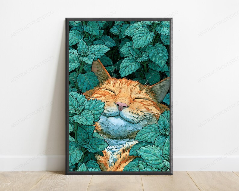 May include: A framed vertical art print featuring an orange tabby cat with closed eyes and a content expression, nestled within a dense patch of vibrant teal green mint leaves. The cat's fur is orange with darker stripes, and the leaves are detailed.