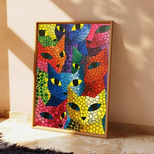 May include: A rectangular framed wall art print featuring a vibrant, multi-colored mosaic pattern of overlapping cat faces. The cats are rendered in bright shades of yellow, orange, red, blue, green, and pink, each covered in black circular spots.
