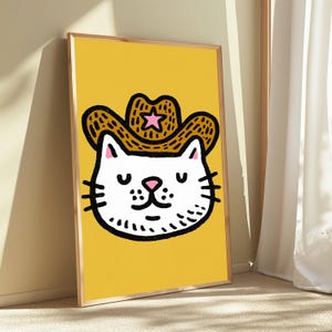 Wydruk pop-art z kotem kowbojem | Grafika ścienna z motywem dzikiego zachodu | Minimalistyczna dekoracja z uroczym kotem | Pobieranie cyfrowe A3 A2 A1 zdjęcie 2