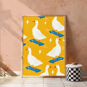 May include: A framed wall art print featuring a repeating pattern of white geese wearing blue sneakers while riding blue skateboards on a vibrant yellow background, interspersed with small white lightning bolt icons throughout the design.