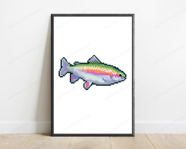 May include: A framed wall art print featuring a pixel art illustration of a rainbow trout. The fish is rendered in a digital style with a white belly, a vibrant iridescent stripe along its side, and purple-toned fins, centered on a white background.
