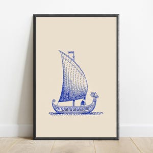 May include: A framed wall art print featuring a blue ink illustration of an ancient Greek ship with a large sail and a meander pattern along the hull. The ship is depicted on a light beige background, showcasing a figure on deck and a ram head prow.