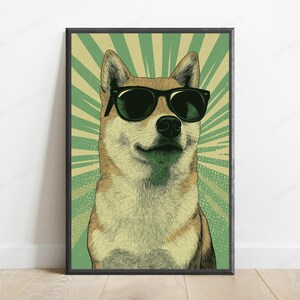 May include: A framed wall art print featuring a stylized illustration of a Shiba Inu dog wearing black sunglasses. The dog is centered against a background of radiating light green and cream-colored sunburst lines, creating a bold graphic effect.