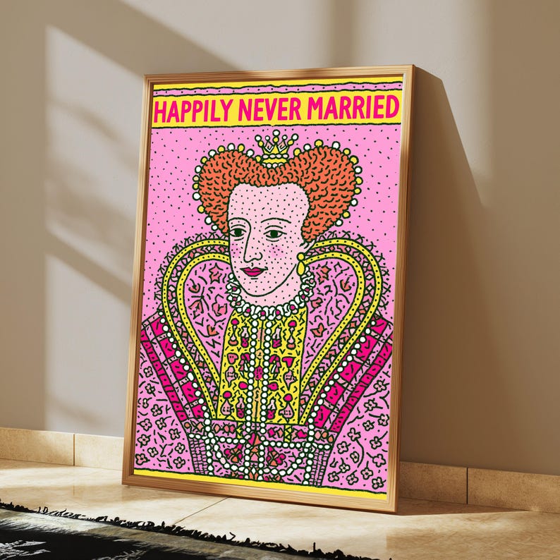 May include: A framed rectangular wall art print featuring a stylized illustration of a monarch with orange hair and a crown, set against a pink background with black dots. The text HAPPILY NEVER MARRIED is printed in yellow at the top of the print.