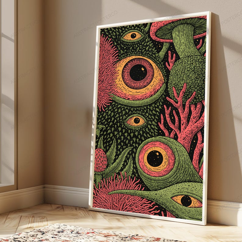 May include: A rectangular framed wall art print featuring a dense, surreal illustration with multiple large, detailed eyes, textured green organic shapes, coral-like structures, and pink spiky elements set against a dark, starry background.