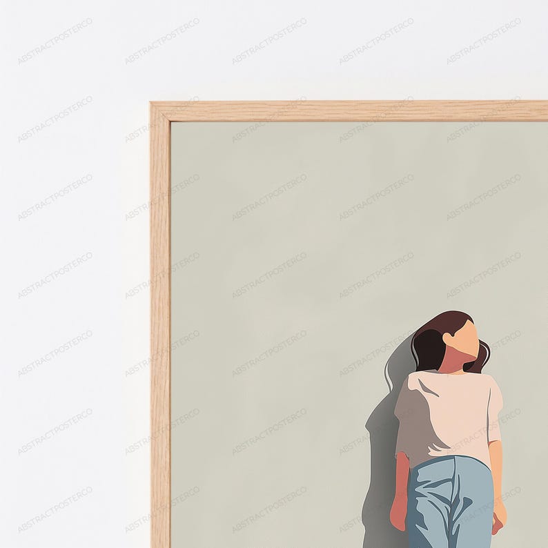 May include: A framed wall art print featuring a stylized illustration of a person with dark hair wearing a light-colored short-sleeved top and blue pants. The figure is positioned against a solid light beige background within a light wood frame.