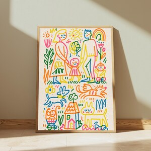 May include: A framed wall art print featuring a colorful, hand-drawn style illustration of a family with two children, a house, a dog, and a cat. The artwork uses vibrant red, yellow, blue, green, and orange lines on a cream background.