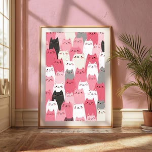 May include: A framed wall art print featuring a repeating pattern of stylized cats in various shades of pink, white, gray, and black. The cats have simple facial features, including small eyes, noses, and whiskers, arranged in a dense, vertical composition.
