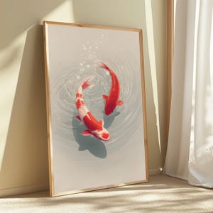 May include: A framed vertical wall art print featuring two koi fish swimming in a circular motion within light gray water. One fish is solid red, while the other is white with red patches. Ripples and small bubbles surround the fish in the water.