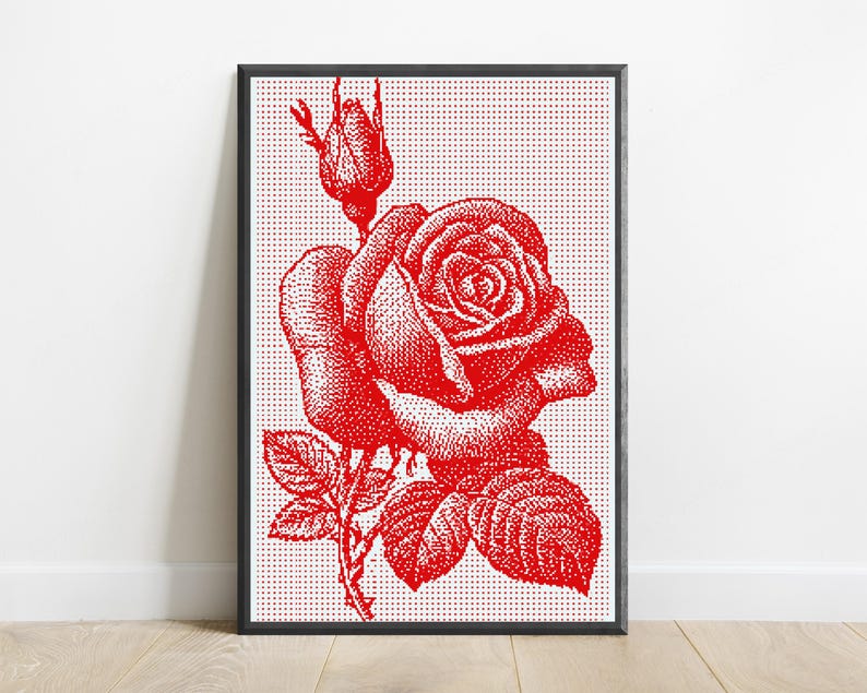 Pode incluir: Uma impress&atilde;o de arte de parede retangular emoldurada com uma ilustra&ccedil;&atilde;o de pontos vermelhos de uma rosa em flor e um bot&atilde;o de rosa. A obra &eacute; composta por pontos vermelhos densos sobre um fundo branco, dentro de uma moldura preta fina.