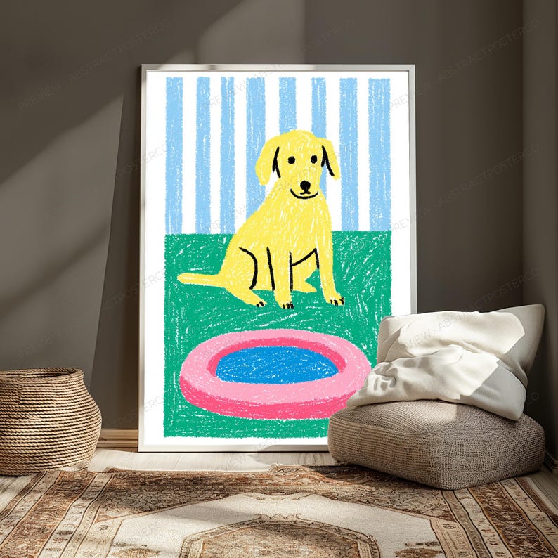May include: A framed wall art print featuring a yellow dog sitting on a green surface in front of a light blue and white striped background. In the foreground, there is a pink circular object with a blue centre, all rendered in a crayon style.
