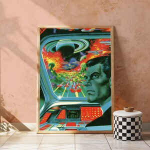 May include: A framed science fiction art print depicting a person in a cockpit looking out at a space battle. The scene features a planet with rings, multiple flying spacecraft, and explosions in a vibrant, colorful cosmic setting with a control panel.