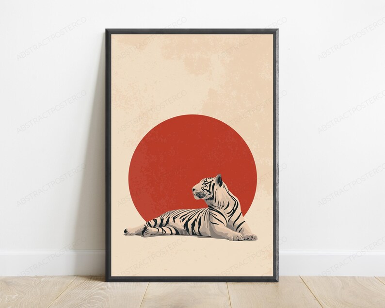 Puede incluir: Una l&aacute;mina de arte mural enmarcada que muestra un tigre blanco con rayas negras tumbado frente a un gran c&iacute;rculo rojo s&oacute;lido. El fondo es de color beige claro con una textura sutil y desgastada, todo dentro de un marco negro fino.