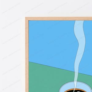 May include: A framed wall art print featuring a graphic illustration of a coffee cup with rising steam. The composition is divided into a bright blue upper section and a green lower section, enclosed in a light-coloured wooden frame.
