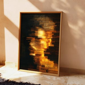 May include: A rectangular framed wall art piece featuring a digital glitch effect. The artwork displays a vertical composition of horizontal, fragmented lines in shades of deep black, dark brown, and vibrant golden yellow, creating an abstract portrait.
