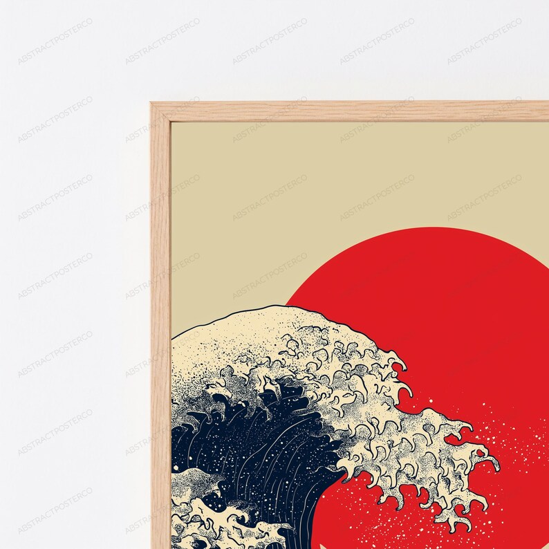 May include: A framed wall art print featuring a stylized dark blue ocean wave with cream-colored foam crests set against a solid red circular sun and a light beige background. The artwork is enclosed in a thin, light-toned wooden frame.