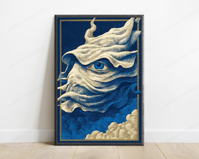 May include: A framed vertical art print featuring a stylized, cream-colored, flowing fabric-like form with a single, detailed blue eye at its center. The background is a deep navy blue with textured clouds at the bottom, all enclosed in a gold border.