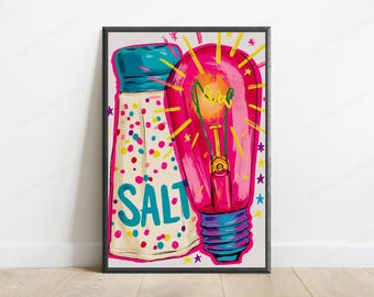 Puede incluir: Una lámina artística enmarcada que muestra un salero blanco con tapa azul y puntos de confeti de colores, con la palabra SALT en azul. Junto a él, una bombilla de color rosa brillante con rayos amarillos y pequeñas estrellas en estilo pop art.
