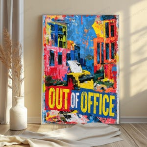 May include: A rectangular wall art print featuring a vibrant, abstract urban scene with bold splashes of red, yellow, and blue paint. The artwork displays a printer in the center and the text OUT OF OFFICE in large, yellow and white capital letters.