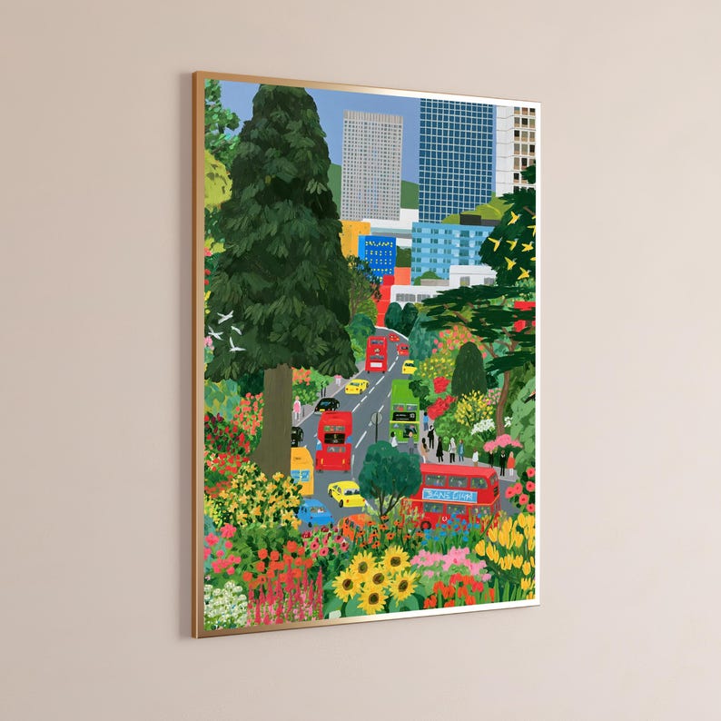 May include: A framed vertical art print depicting a vibrant city street scene with red double-decker buses, yellow taxis, and blue cars driving through a lush park filled with colorful flowers, green trees, and modern skyscrapers in the background.