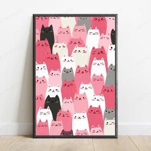 May include: A rectangular framed wall art print featuring a dense, repeating pattern of stylized cartoon cats in various shades of pink, white, black, and gray. Each cat has a simple face with small eyes, a tiny nose, and a mouth, arranged vertically.