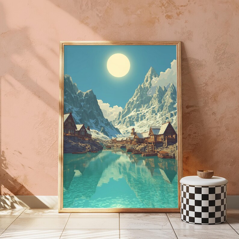 Puede incluir: Una impresi&oacute;n art&iacute;stica enmarcada representa una serena escena de un pueblo de monta&ntilde;a. La obra presenta monta&ntilde;as cubiertas de nieve, un sol brillante y un lago turquesa que refleja el pueblo y el cielo. El marco es de color madera clara.