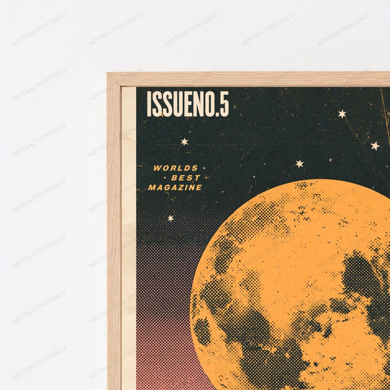 May include: A framed wall art print featuring a dark background with a large orange moon and small white stars. The text ISSUENO.5 and WORLDS BEST MAGAZINE are printed in white. The design has a textured, dotted halftone effect throughout.