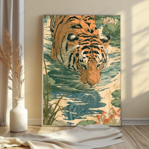 May include: A vertical wall art print featuring an orange and black tiger wading through shallow water filled with green lily pads and blooming lotus flowers. The tiger is positioned in the center, looking forward with a focused expression.