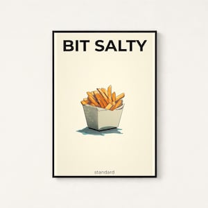 May include: A rectangular wall art print with a cream background and a thin black frame. The text BIT SALTY appears in black at the top, with a drawing of golden-brown french fries in a white container below and the word standard at the bottom.
