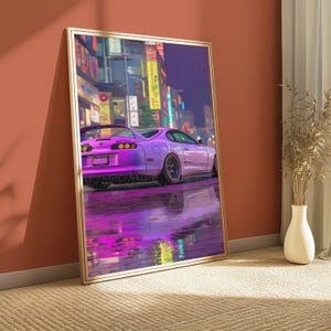 May include: A framed vertical wall art print depicting a purple sports car parked on a wet street at night. The background features a blurred city scene with illuminated yellow and blue neon signs, and the car reflects on the rain-slicked ground.