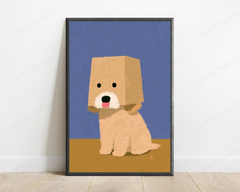 May include: A framed digital illustration of a light brown dog sitting against a blue background. The dog has a tan paper bag over its head with two black circular eyes, a white muzzle, a black nose, and a small pink tongue sticking out.
