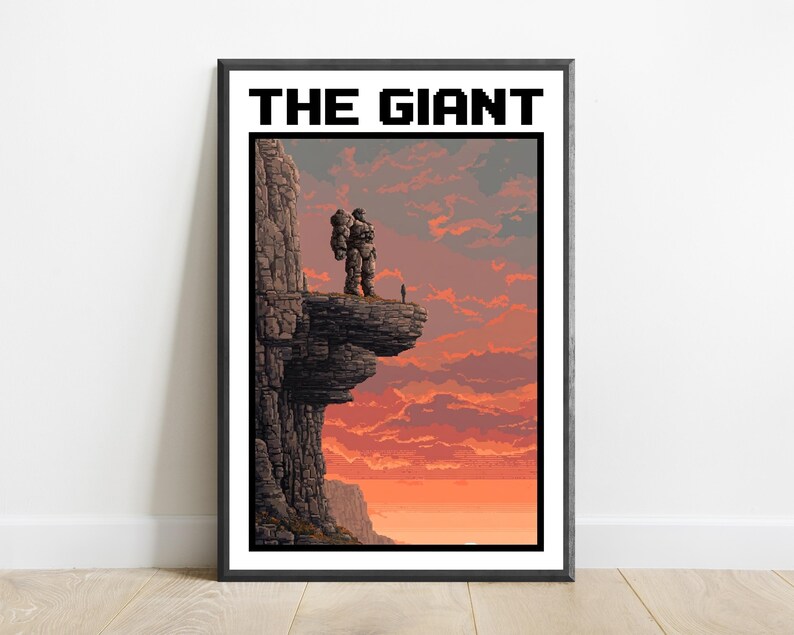 May include: A framed pixel art print titled THE GIANT, featuring a large stone-like figure standing on a cliff edge overlooking a sunset sky with orange and red clouds. A small silhouette of a person stands nearby on the rocky ledge.