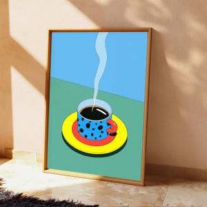 May include: A framed art print featuring a graphic illustration of a blue coffee mug with black spots, a red handle, and a yellow saucer. The mug sits on a green surface against a light blue background, with a thin white wisp of steam rising upward.