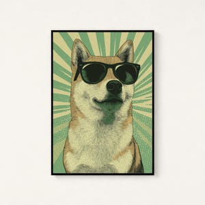 May include: A framed wall art print featuring a tan and white Shiba Inu dog wearing black sunglasses. The background consists of a light green and cream-coloured sunburst pattern with a dotted texture, all enclosed within a thin black frame.