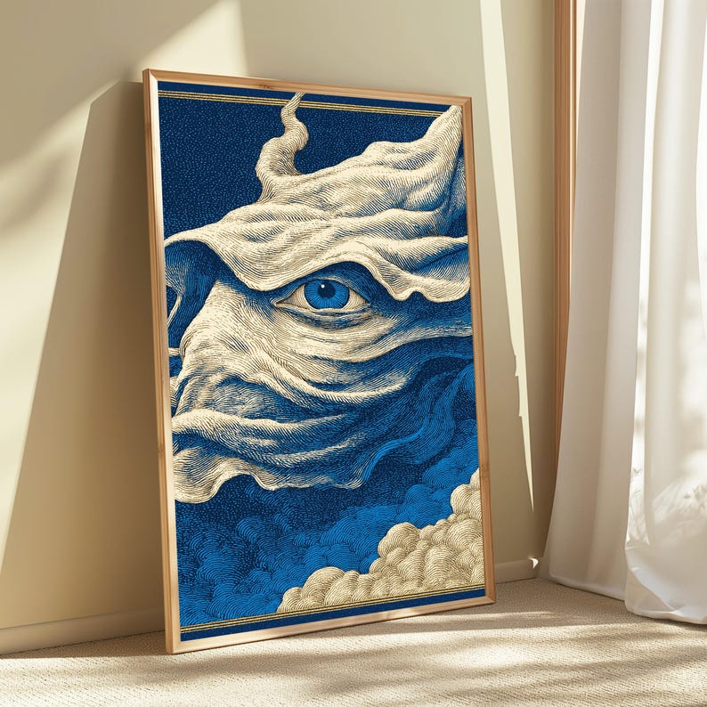 May include: A framed rectangular wall art print featuring a detailed illustration of a single blue eye centered within swirling, cream-colored fabric-like forms against a deep blue stippled background with clouds at the bottom edge.