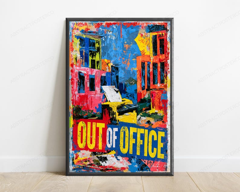 May include: A rectangular framed wall art print featuring a vibrant abstract cityscape with bold splashes of blue, red, yellow, and orange. The center depicts a yellow printer, and the bottom displays the text OUT OF OFFICE in large letters.