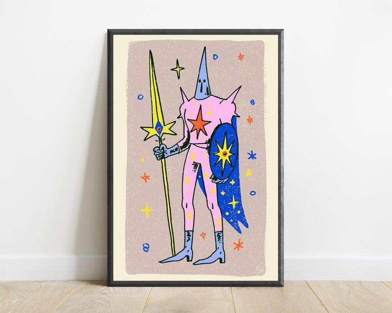 May include: A framed art print featuring a stylised figure in a pink suit with a pointed hood, holding a long yellow spear with a blue eye emblem. The figure wears a blue cape and carries a blue shield with a yellow star, set against a beige background.
