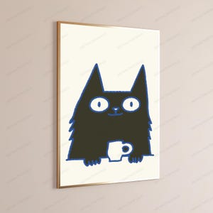 May include: A framed wall art print featuring a stylized black cat with large white eyes and a blue outline. The cat is depicted from the chest up, holding a small white mug with a blue outline against a plain, light-colored background.