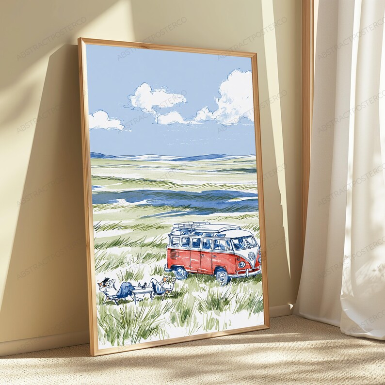 May include: A framed vertical art print featuring a watercolor-style illustration of a red and white vintage camper van parked in a grassy field. Two figures are lounging in chairs near the vehicle under a blue sky with white clouds.