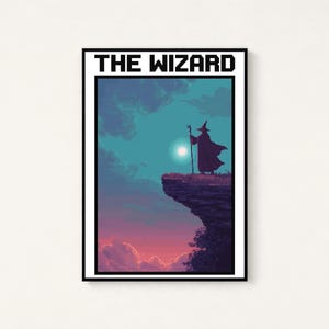 May include: A rectangular framed wall art print featuring pixel art of a wizard standing on a cliff edge holding a staff. The scene depicts a sunset sky with blue and purple clouds and a bright moon. The text THE WIZARD is printed in black.