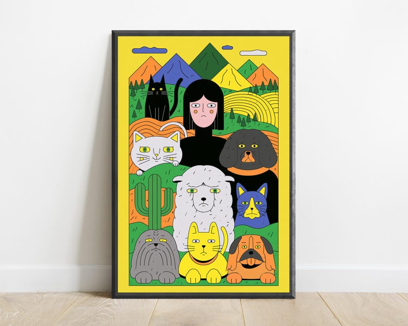 May include: A framed art print featuring a central figure with black hair surrounded by a variety of colourful illustrated animals including cats, dogs, and a sheep against a bright yellow background with green hills, mountains, and a cactus.