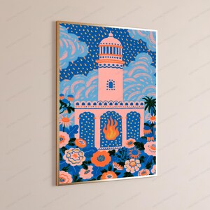 May include: A framed vertical wall art print featuring a light pink lighthouse structure centered against a dark blue sky with yellow rain-like dashes. The base is surrounded by vibrant orange and pink flowers, with a stylized orange flame icon.