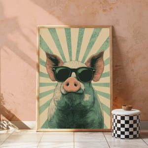May include: A framed wall art print featuring a stylised illustration of a pig wearing black sunglasses. The pig is centred against a background of alternating light beige and teal sunburst rays with a subtle dotted texture pattern throughout.