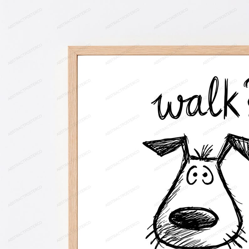 May include: A framed wall art print featuring a black ink sketch of a dog's head with floppy ears and a large nose. Above the dog, the word walk is written in a casual, hand-drawn script style. The artwork is enclosed in a light-toned wooden frame.