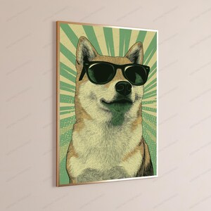 May include: A framed wall art print featuring a tan and white Shiba Inu dog wearing black sunglasses. The background consists of a green and light yellow sunburst pattern with a dotted texture, all enclosed within a thin metallic gold frame.