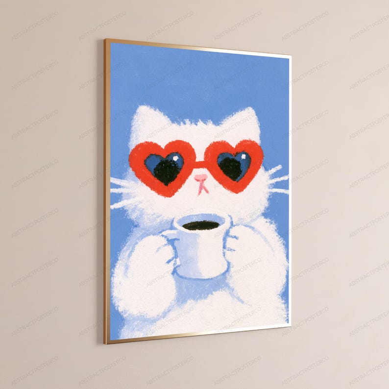 May include: A framed wall art print featuring a white cat against a solid blue background. The cat wears large red heart-shaped sunglasses and holds a white mug filled with a dark beverage. The illustration has a textured, painterly appearance.