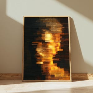May include: A rectangular framed wall art piece featuring a digital glitch effect portrait. The image displays a human silhouette rendered in horizontal bands of bright yellow, orange, and gold light against a deep black background.